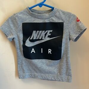 Nike Grey and Black with red Nike on shoulder Size 2T Short Sleeve T Shirt.